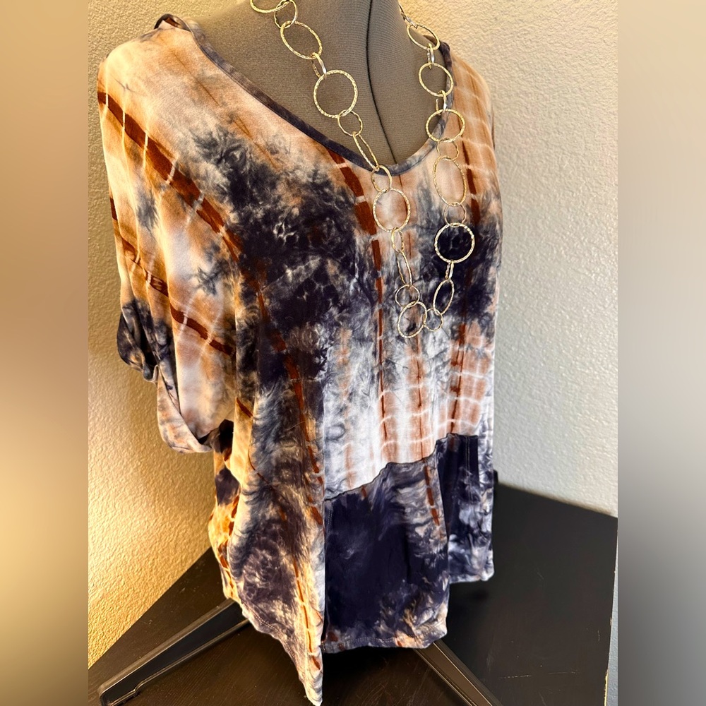 Tie Dye, plus women’s, short sleeved t-shirt in a 1X by 1804 Coin.